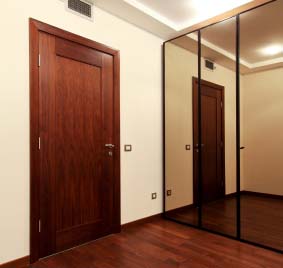 room with mirror closet sliding doors
